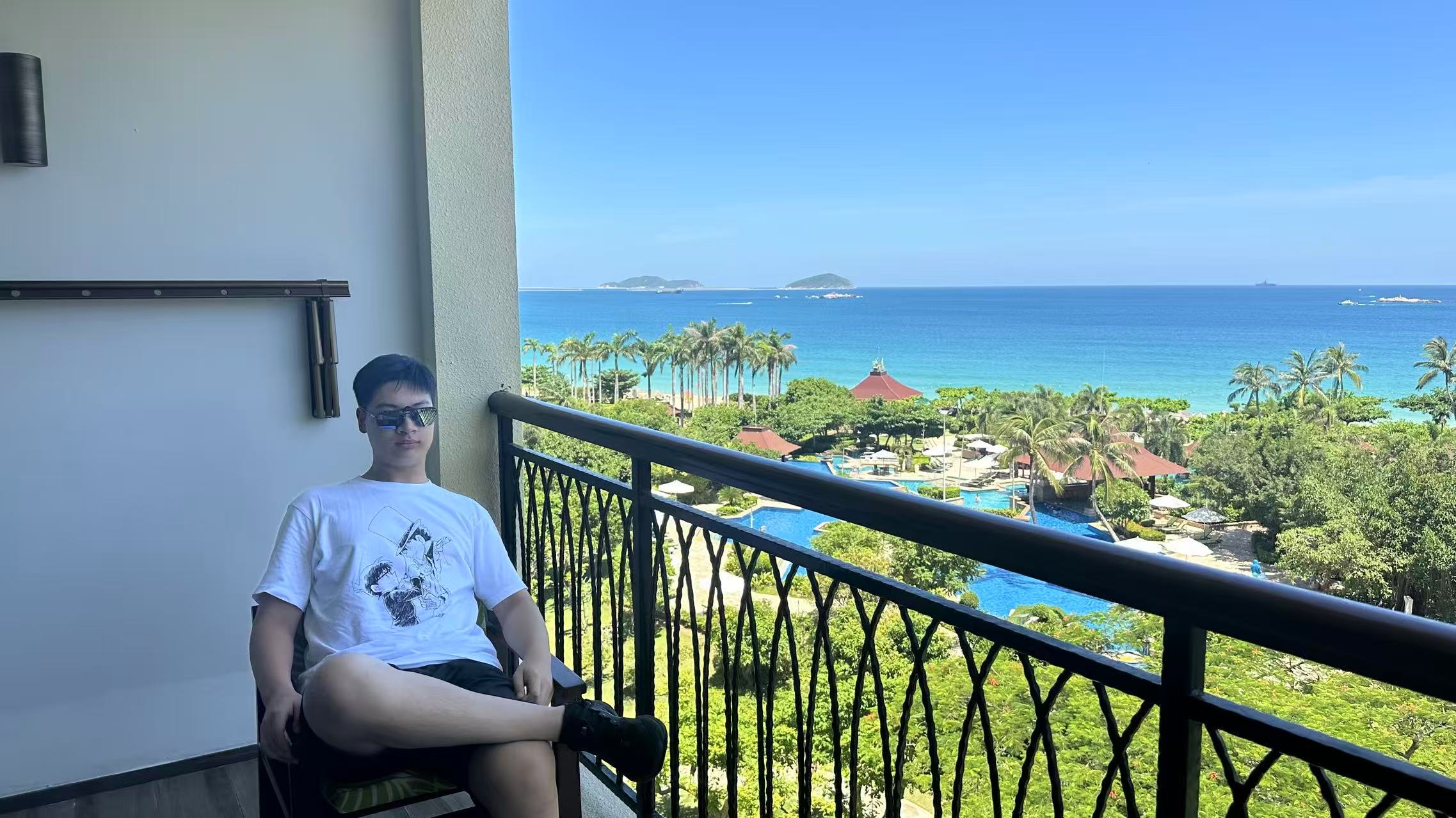 Zhang Zhenming overlooking a tropical ocean
